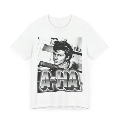 A black graphic t-shirt featuring a retro 1986-style graphic for the band A-HA, possibly with band members in a stylized design.