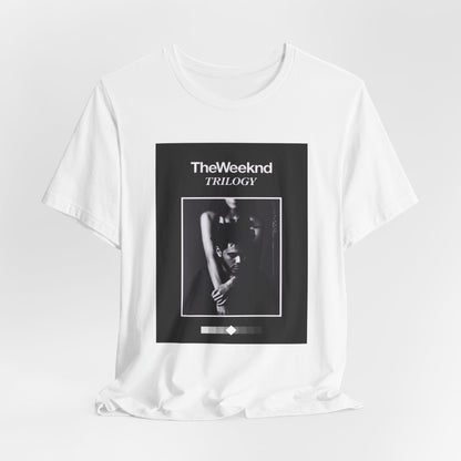 A black graphic t-shirt featuring a graphic related to The Weeknd's 'Trilogy' album.