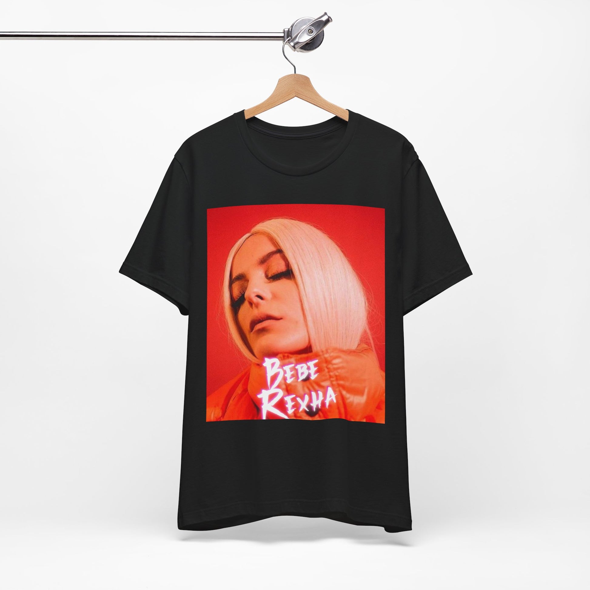A black graphic t-shirt featuring a graphic of Bebe Rexha, designed with a glamorous or dazzling aesthetic.
