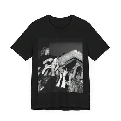 A black graphic t-shirt featuring a 90s graphic or photo of Kurt Cobain from Nirvana stage diving.