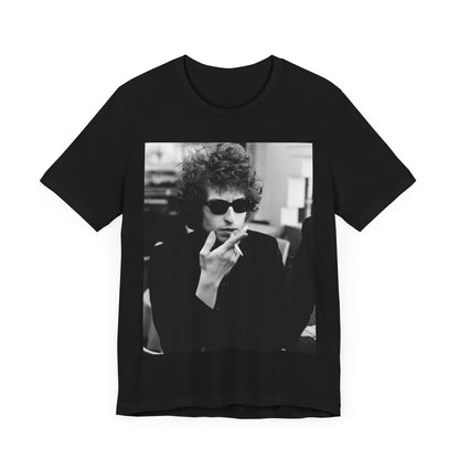 A black graphic t-shirt featuring a retro black and white graphic of Bob Dylan in a rebellious pose.