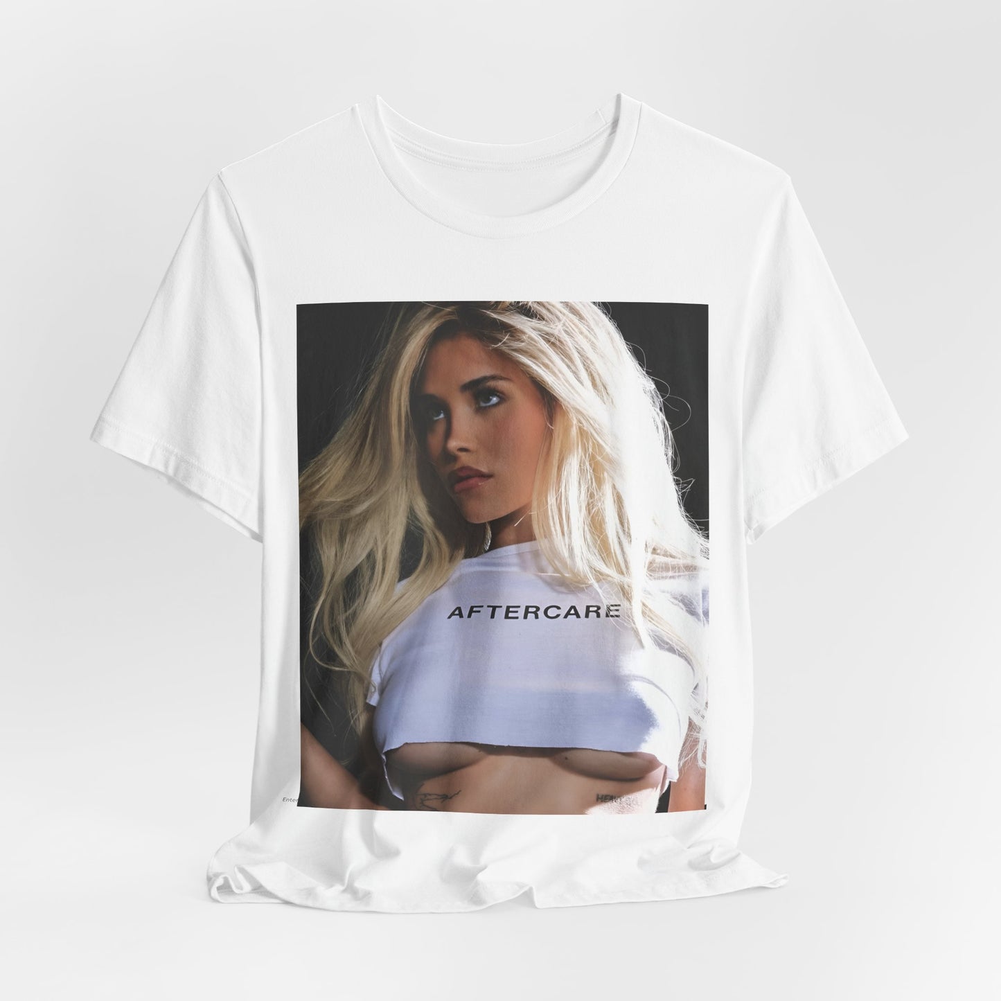 A black graphic t-shirt featuring a graphic related to Nessa Barrett's 'Aftercare' themes.