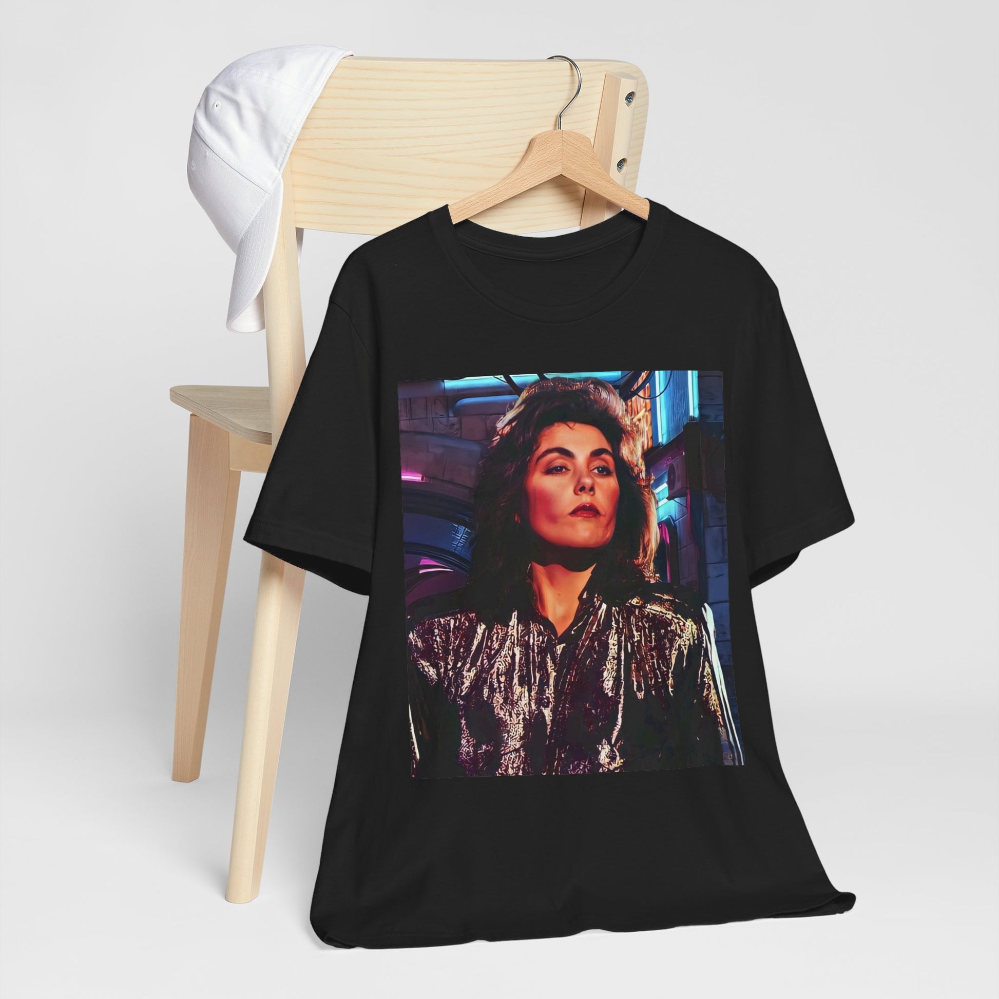 A black graphic t-shirt featuring an 80s synth pop aesthetic graphic of Laura Branigan.