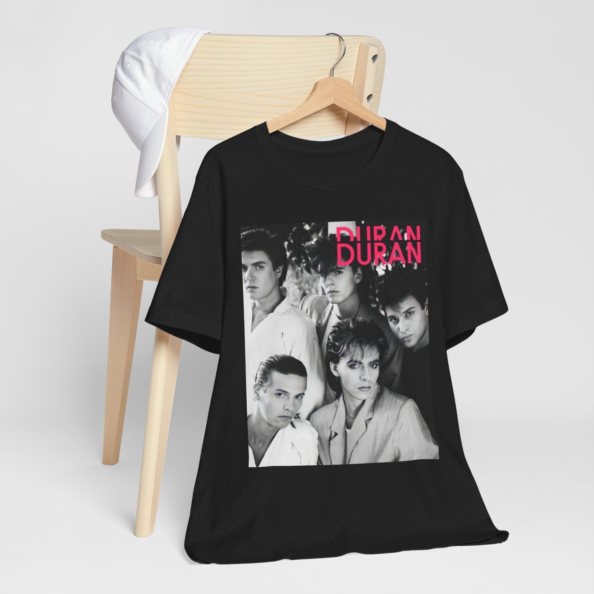 A black graphic t-shirt featuring an 80s black and white monochrome photo of the band Duran Duran.
