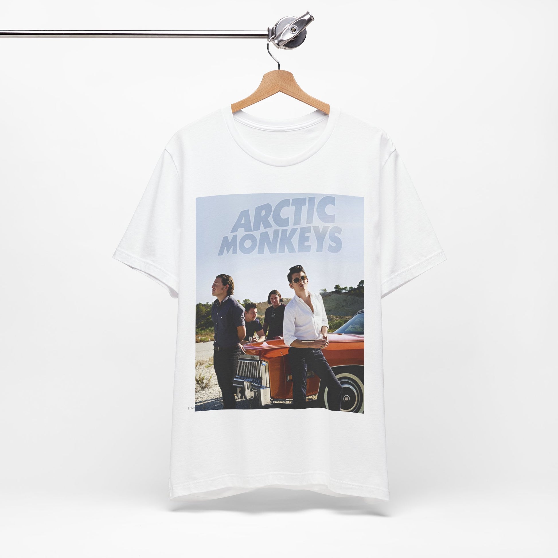 A black graphic t-shirt featuring a design related to Arctic Monkeys' 'AM' album era, possibly with the album art or band imagery.
