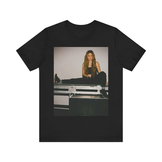A black graphic t-shirt featuring a modern pop essential graphic of Shakira.