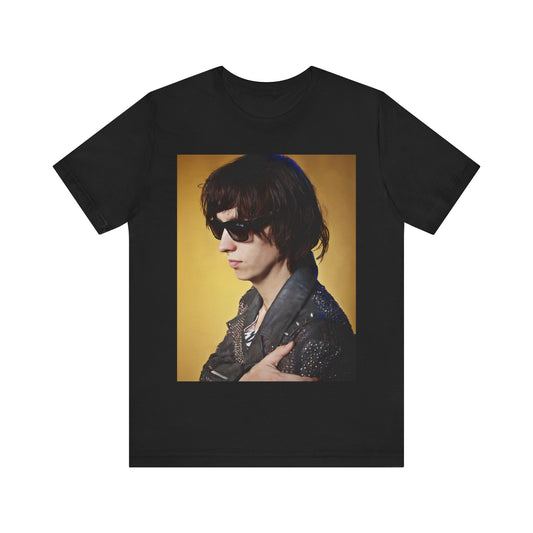 A black graphic t-shirt featuring a retro graphic related to The Strokes' 'Is This It' album era.