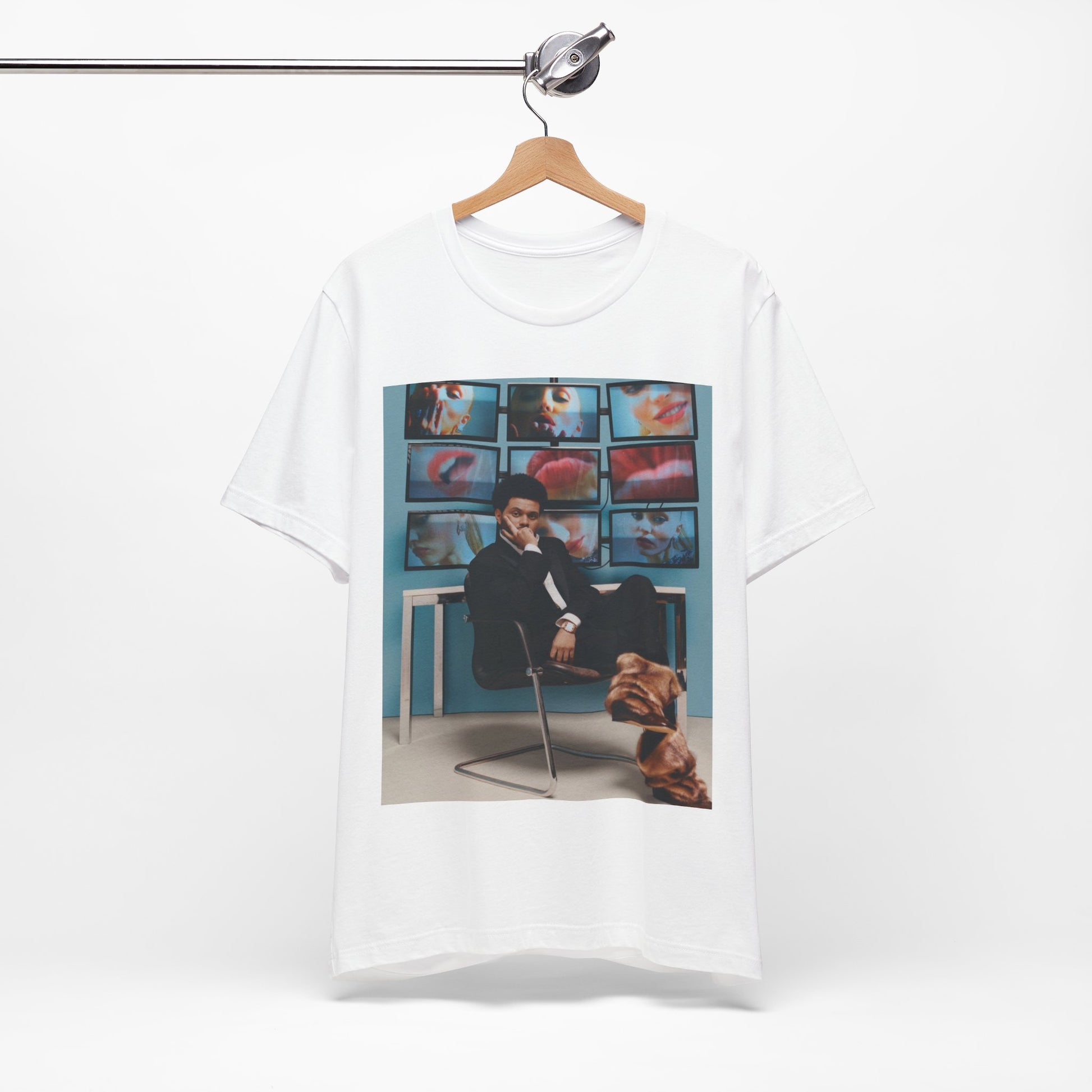 A black graphic t-shirt featuring an aesthetic graphic of The Weeknd.