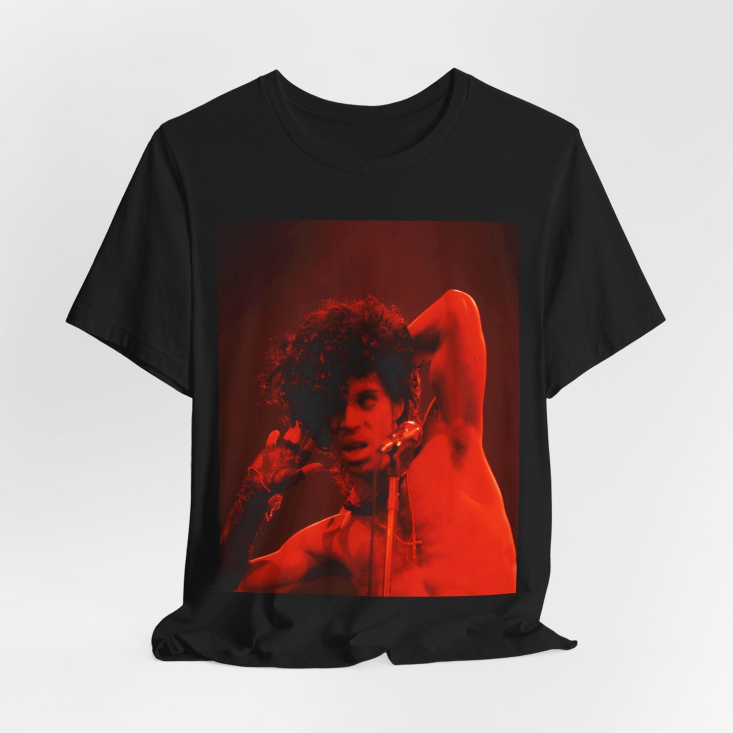 A black graphic t-shirt featuring a concert pop fan graphic of Prince.