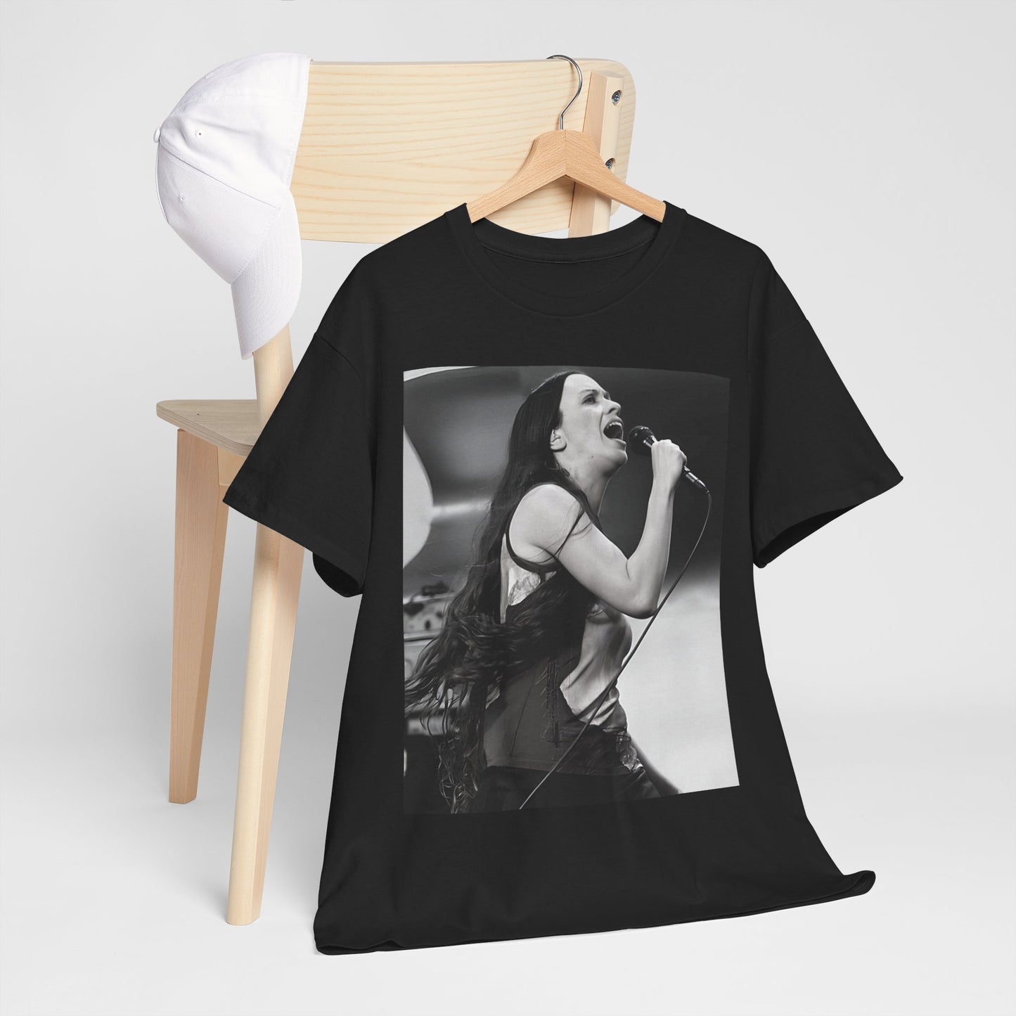 A black graphic t-shirt featuring a concert graphic for Alanis Morissette's 'Jagged Little Pill' Tour from 1995, with tour branding.