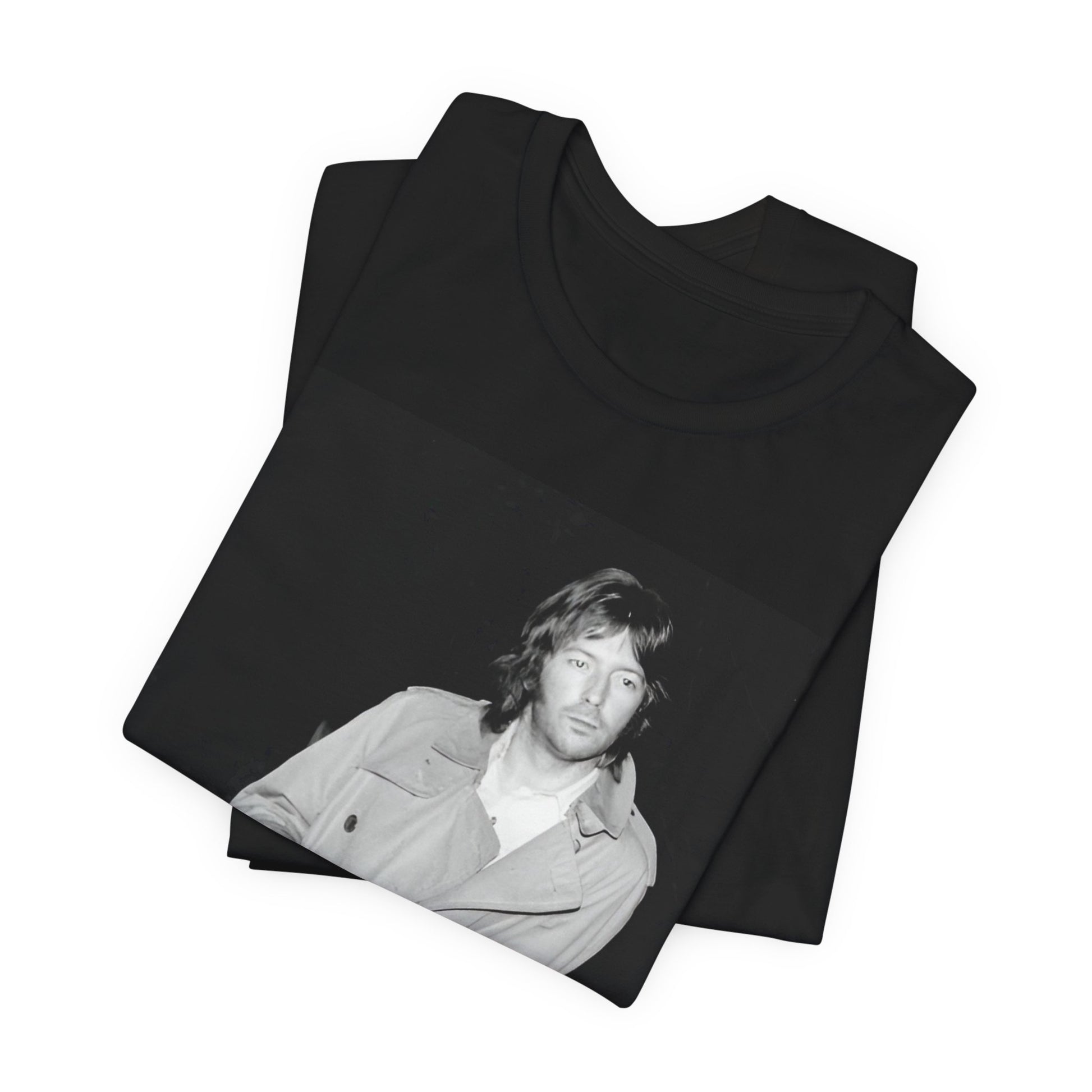 A black graphic t-shirt featuring a retro graphic of Eric Clapton as a blues master.