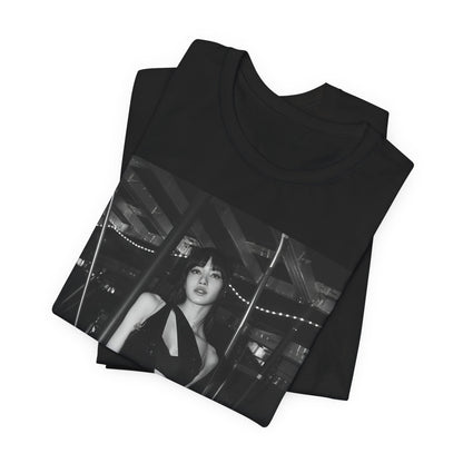 A black graphic t-shirt featuring a black and white graphic or photo of Lisa in a backstage setting.