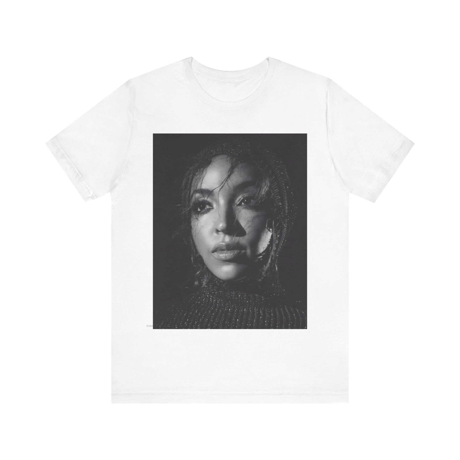 A black graphic t-shirt featuring a black and white portrait photo of Tinashe.