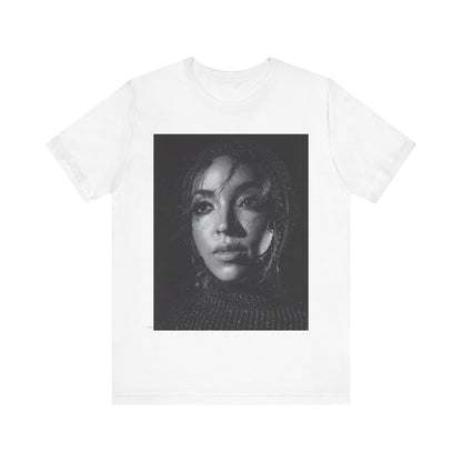 A black graphic t-shirt featuring a black and white portrait photo of Tinashe.