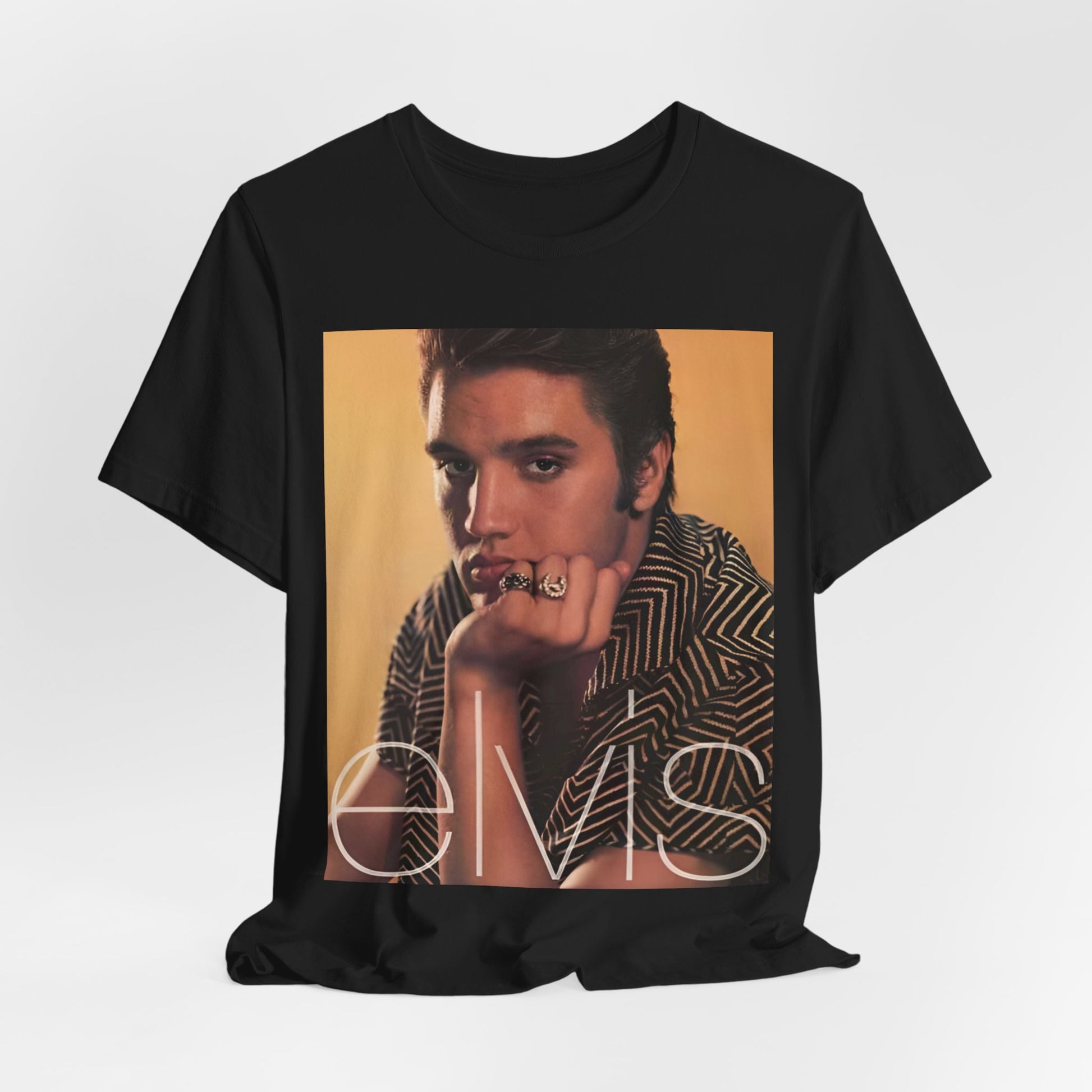 A black graphic t-shirt featuring an aesthetic photo portrait of Elvis Presley.