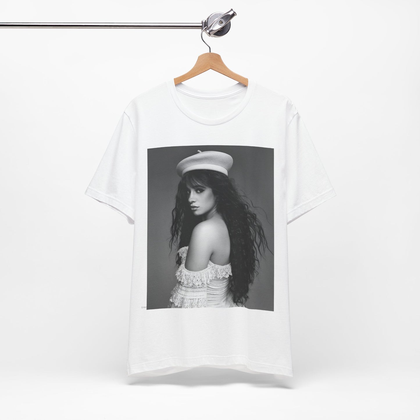 A black graphic t-shirt featuring a black and white graphic of Camila Cabello as a fierce Latina pop star.