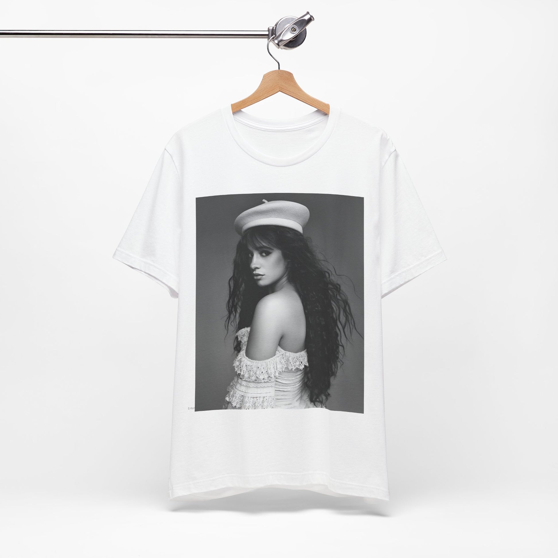 A black graphic t-shirt featuring a black and white graphic of Camila Cabello as a fierce Latina pop star.