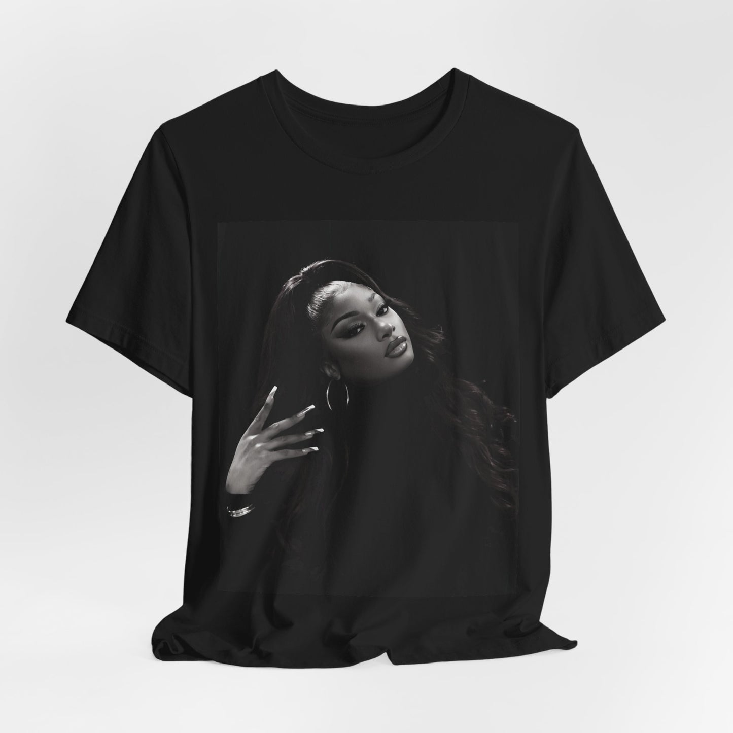 A black graphic t-shirt featuring a black and white, monochrome graphic or photo of Megan Thee Stallion.