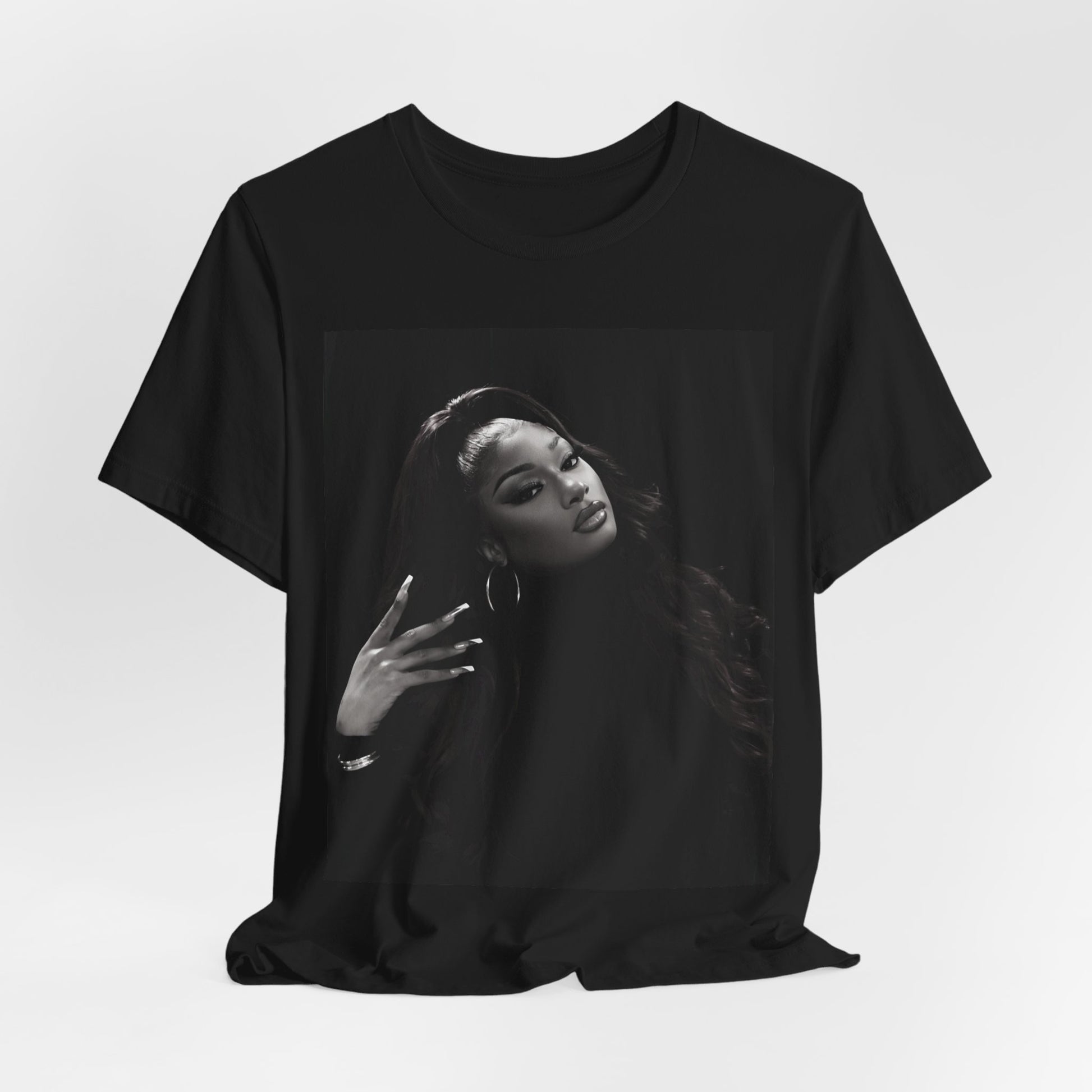 A black graphic t-shirt featuring a black and white, monochrome graphic or photo of Megan Thee Stallion.