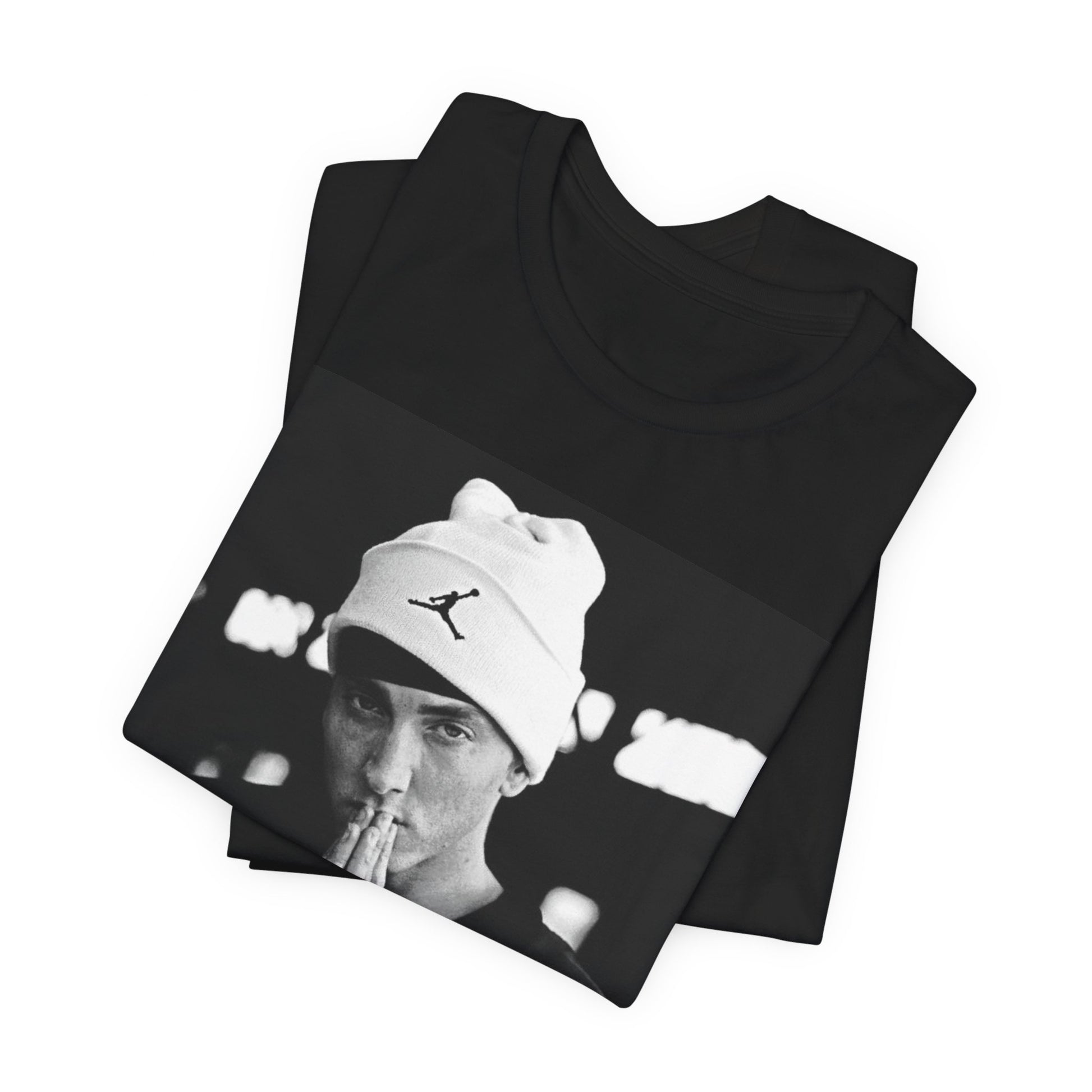 A black graphic t-shirt featuring a black and white portrait photo of Eminem.