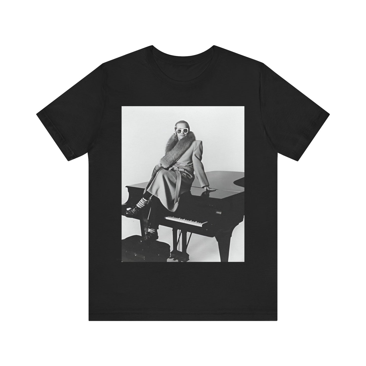 A black graphic t-shirt featuring a black and white photo of Elton John playing the piano.