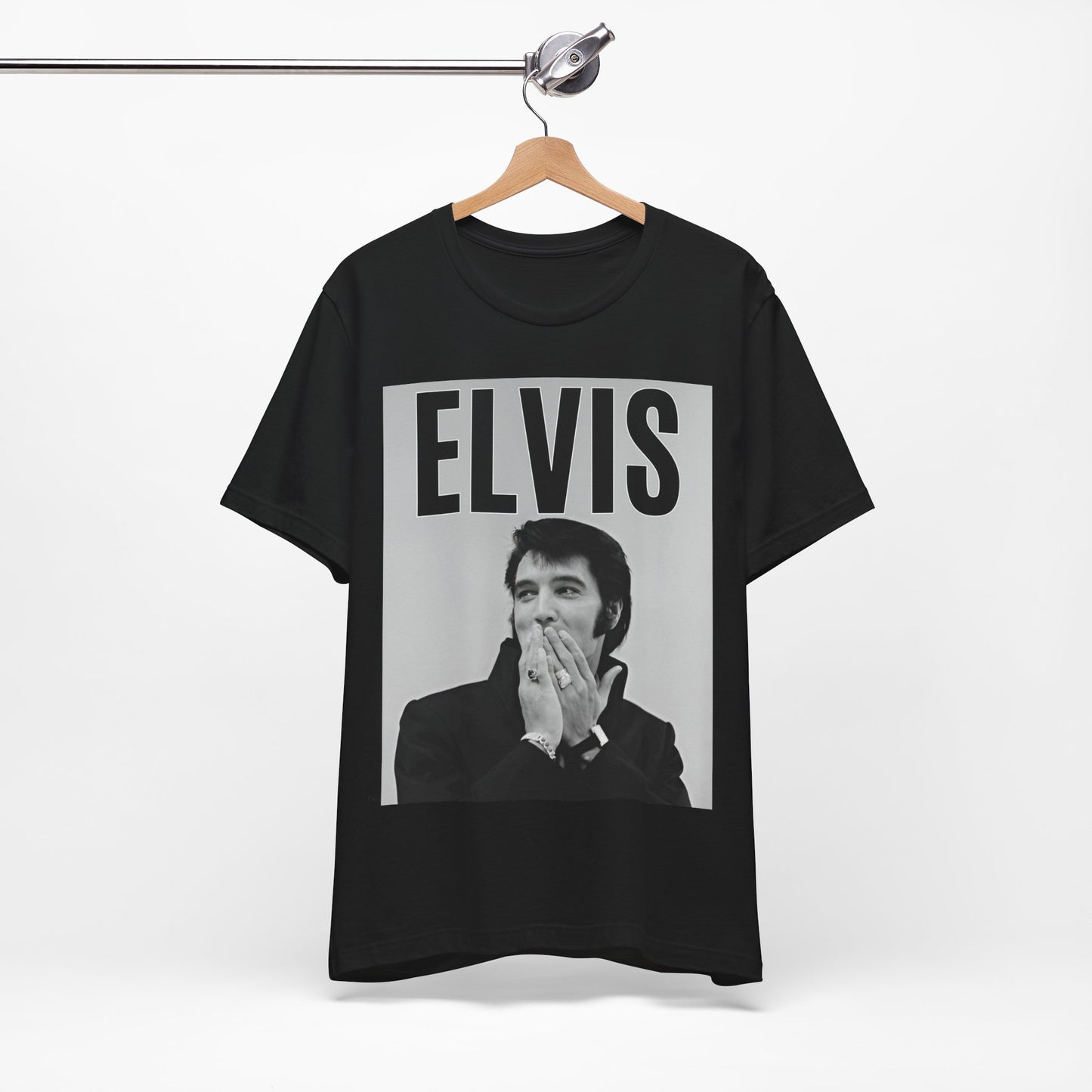 A black graphic t-shirt featuring a retro graphic of Elvis Presley as a 'Rebel With A Cause.'