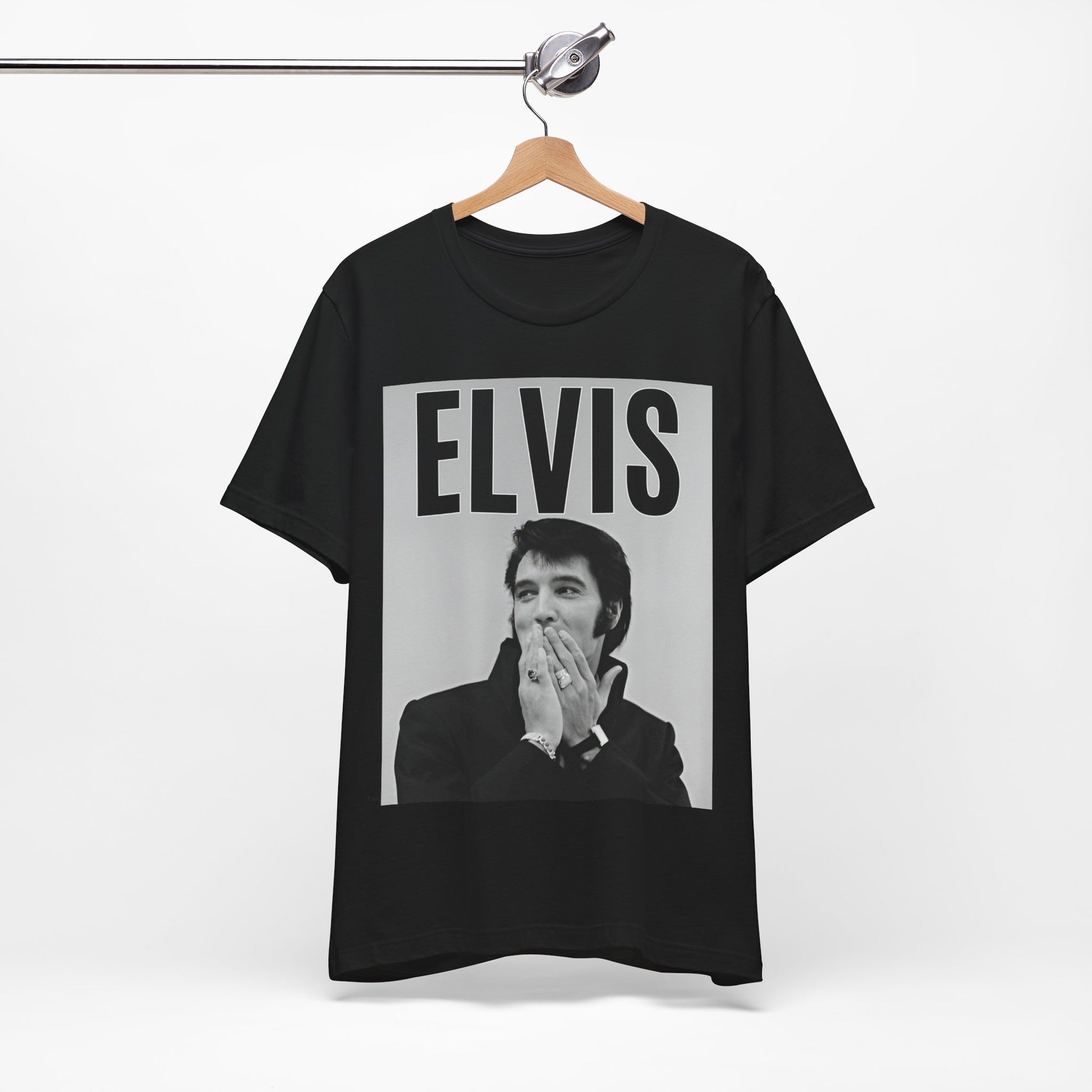 A black graphic t-shirt featuring a retro graphic of Elvis Presley as a 'Rebel With A Cause.'