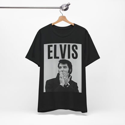 A black graphic t-shirt featuring a retro graphic of Elvis Presley as a 'Rebel With A Cause.'