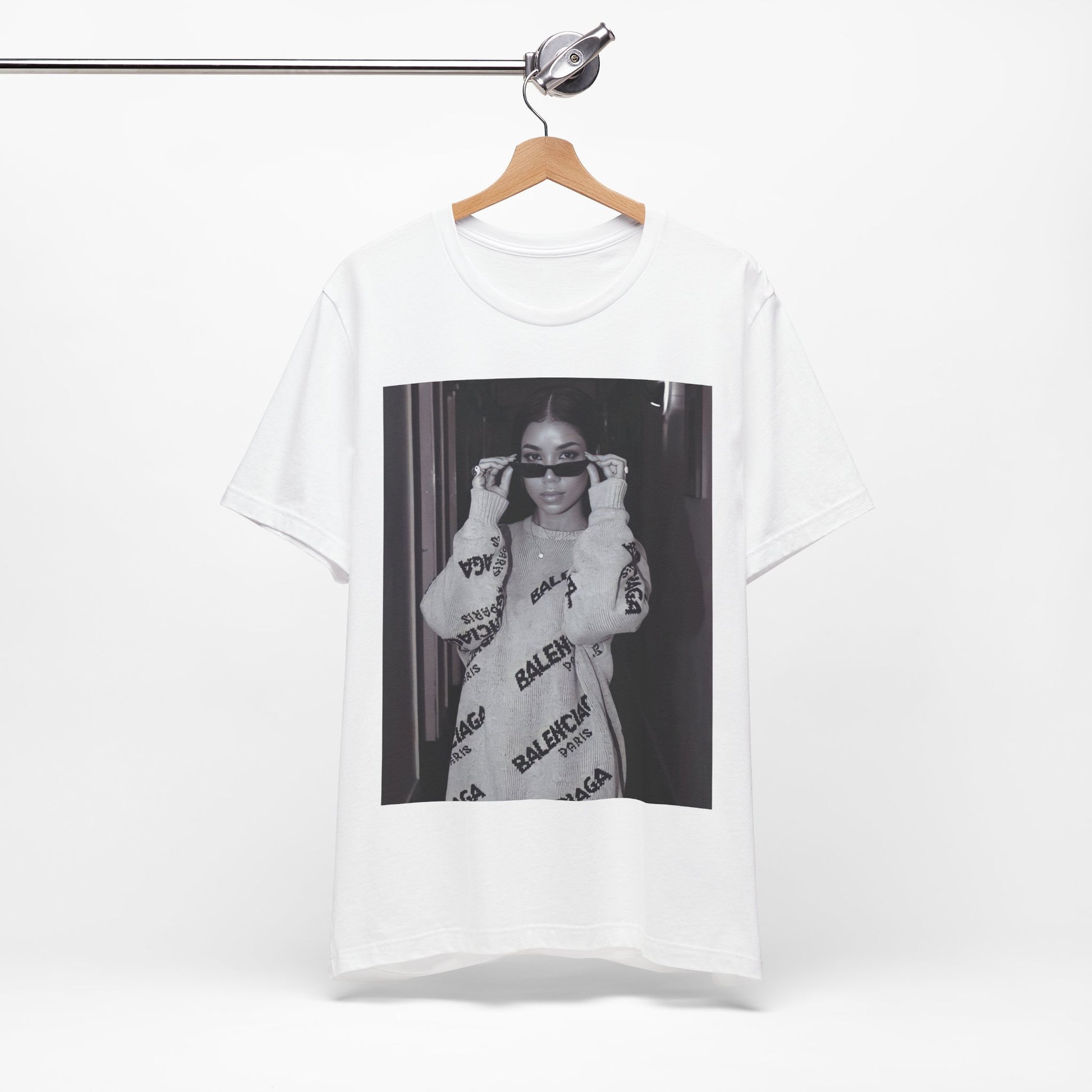 A black graphic t-shirt featuring a black and white, monochrome graphic or photo of Jhene Aiko.