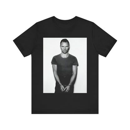 A black graphic t-shirt featuring a black and white portrait photo of Sting.