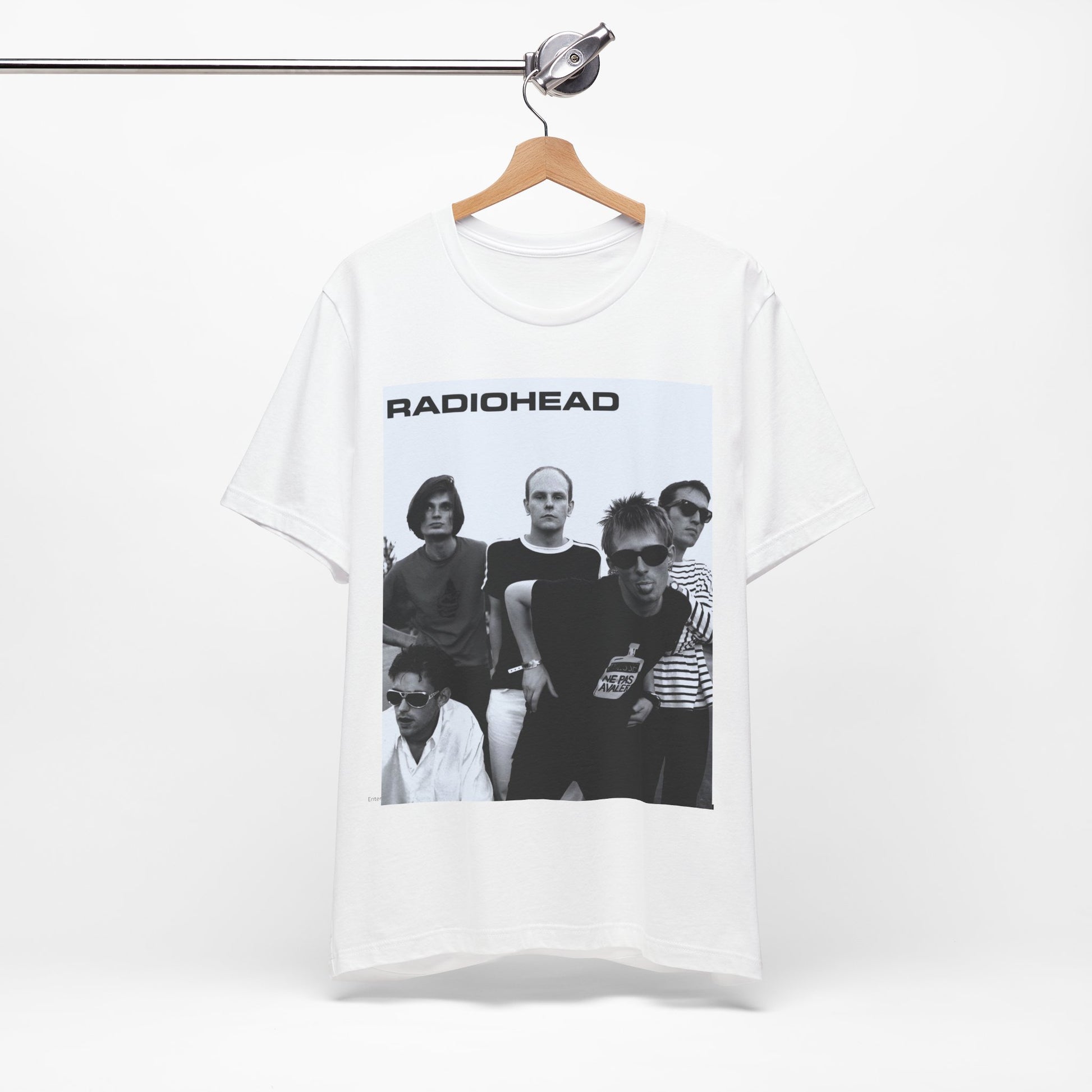 A black graphic t-shirt featuring a vintage 90s graphic related to Radiohead's 'Creep' song or era.