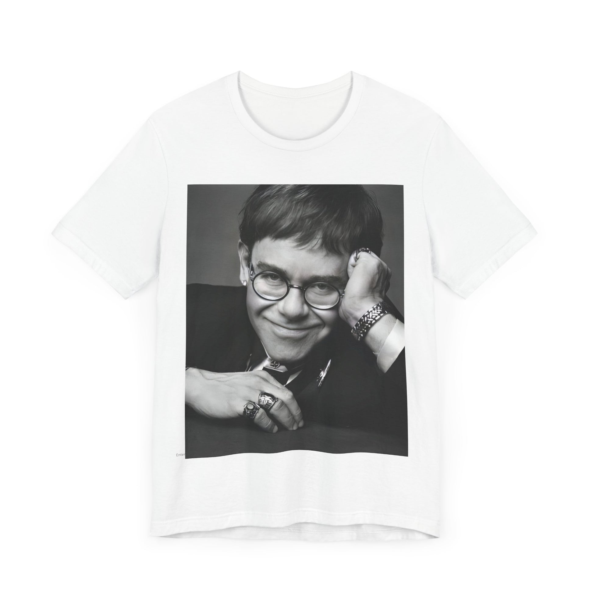 A black graphic t-shirt featuring a retro black and white photo portrait of Elton John.
