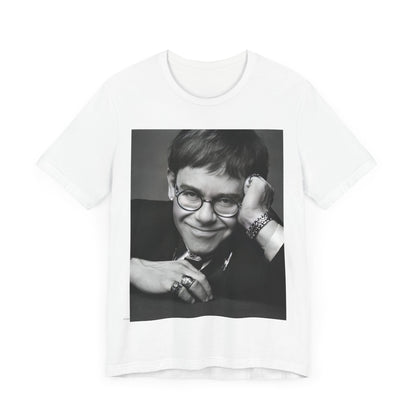 A black graphic t-shirt featuring a retro black and white photo portrait of Elton John.