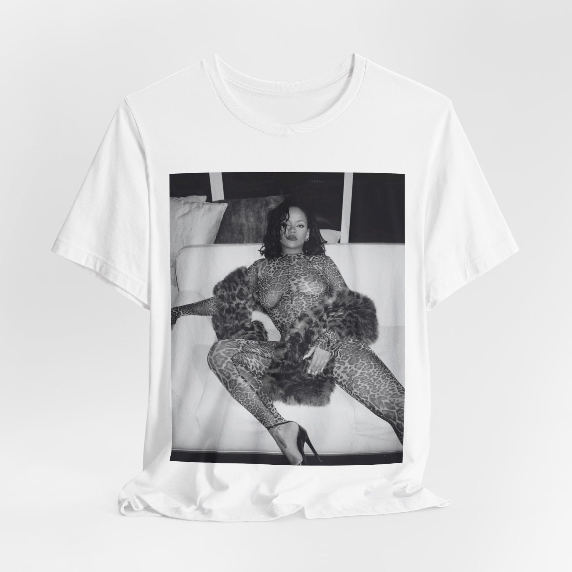 A black graphic t-shirt featuring a black and white, monochrome graphic or photo of Rihanna in a sexy pose.