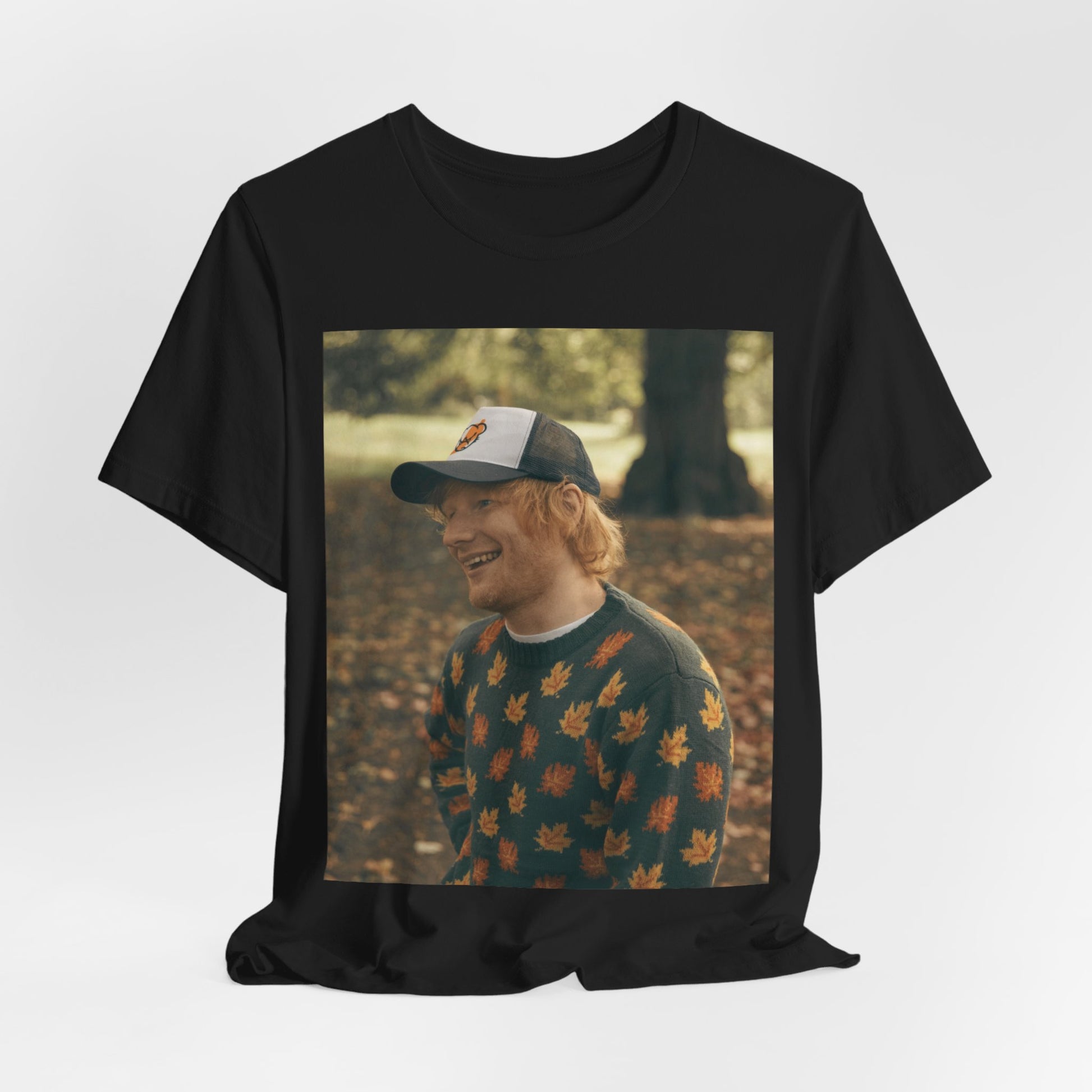 A black graphic t-shirt featuring a graphic related to Ed Sheeran's 'Shape of You' song or era.