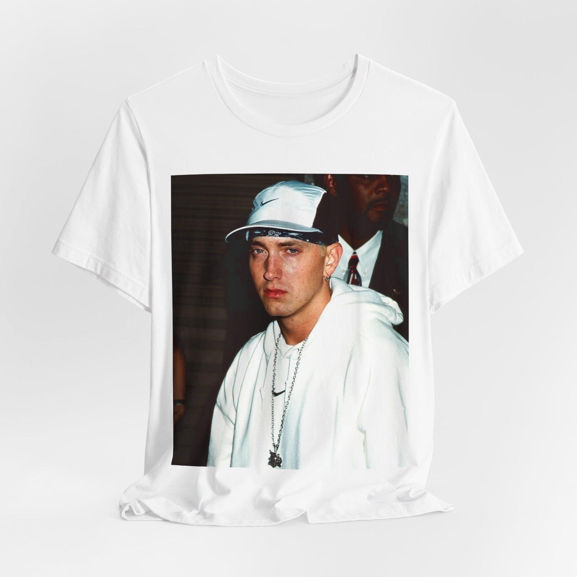 A black graphic t-shirt featuring a retro graphic or photo of Eminem in a backstage setting.