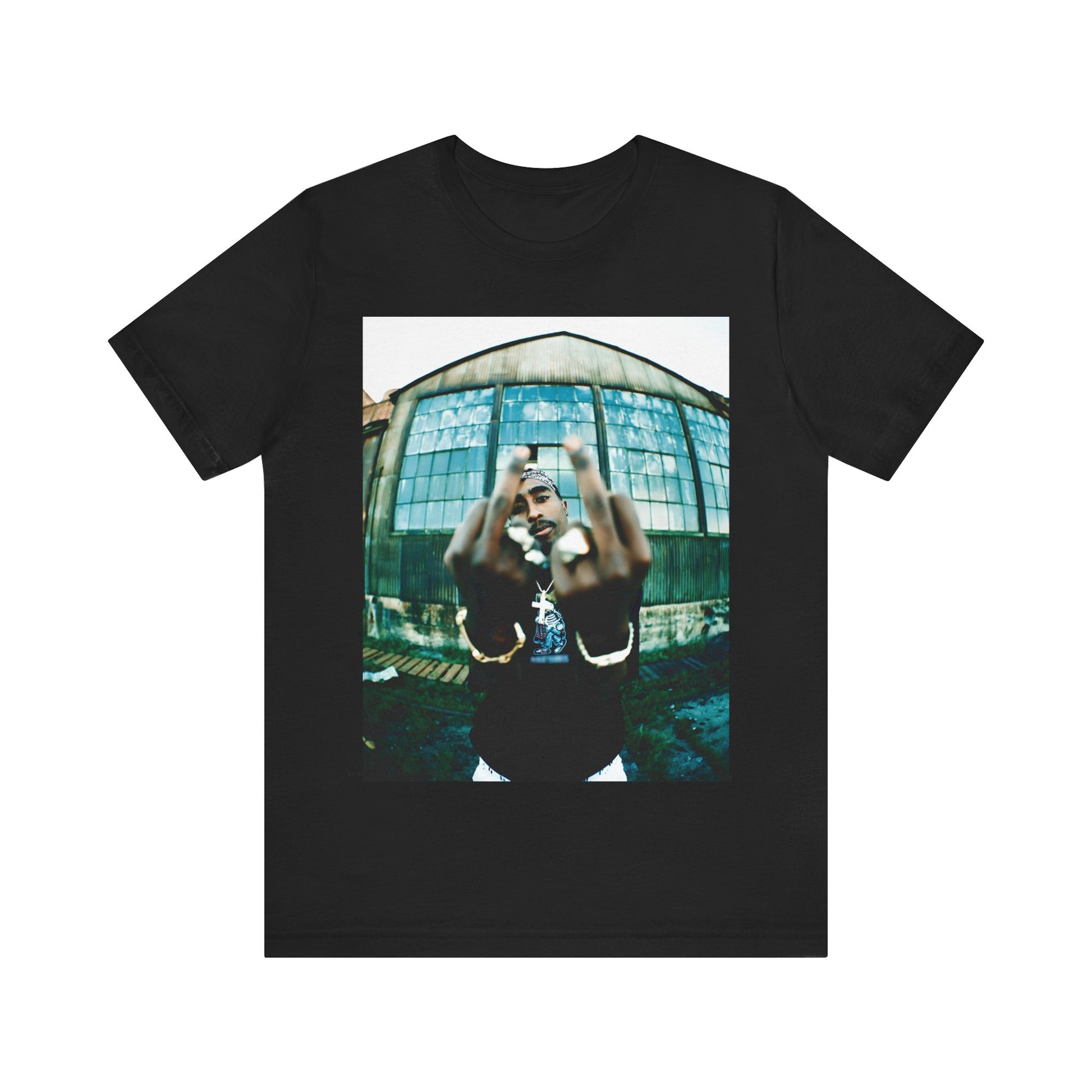 A black graphic t-shirt featuring a graphic of Tupac giving the middle finger.