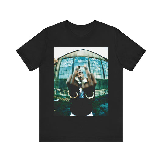 A black graphic t-shirt featuring a graphic of Tupac giving the middle finger.