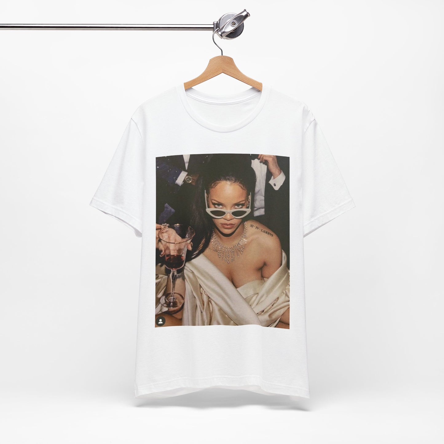 A black graphic t-shirt featuring a graphic of Rihanna as a 'Bad Gal Riri' fashion icon.