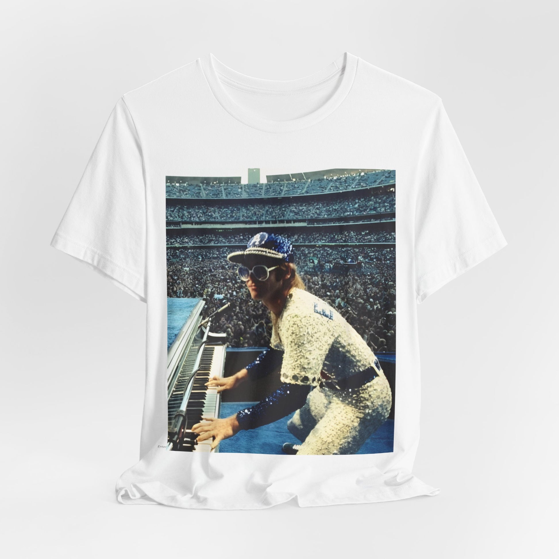A black graphic t-shirt featuring a photo of Elton John from his 1975 Dodgers Stadium concert.