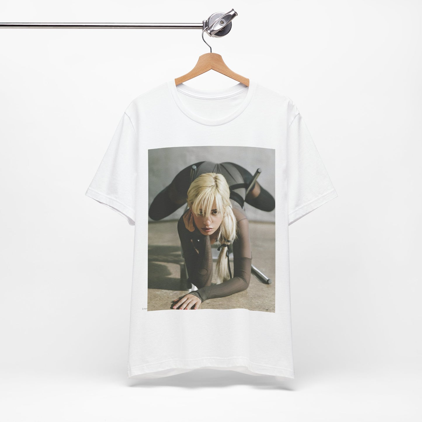 A black graphic t-shirt featuring a vintage-style graphic of Camila Cabello, possibly with a crown or 'Pop Queen' title.
