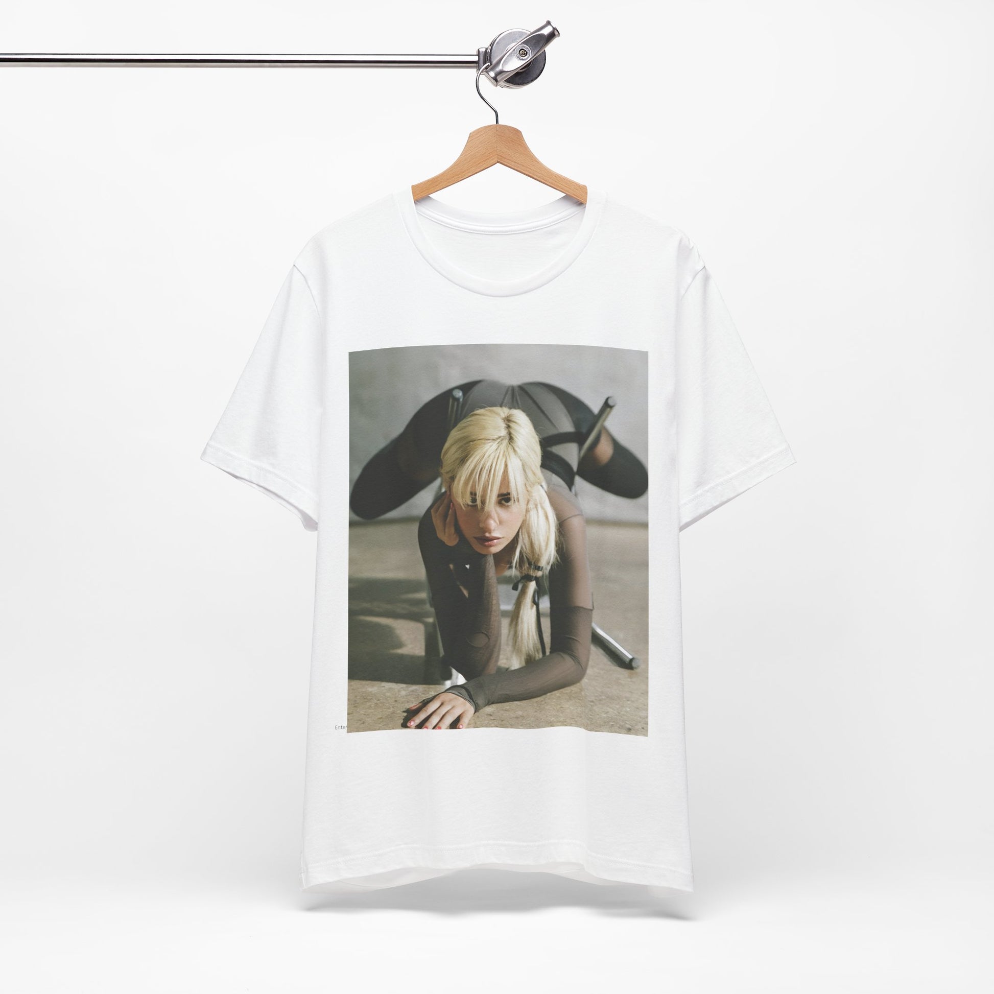A black graphic t-shirt featuring a vintage-style graphic of Camila Cabello, possibly with a crown or 'Pop Queen' title.