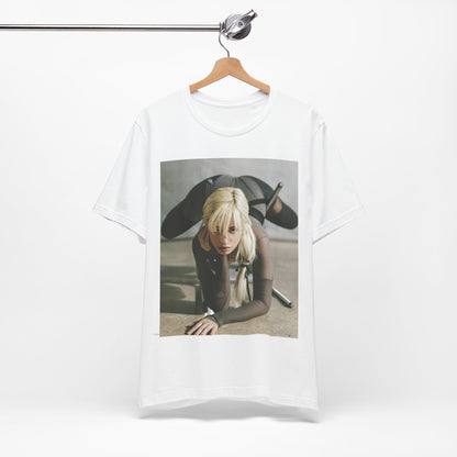 A black graphic t-shirt featuring a vintage-style graphic of Camila Cabello, possibly with a crown or 'Pop Queen' title.