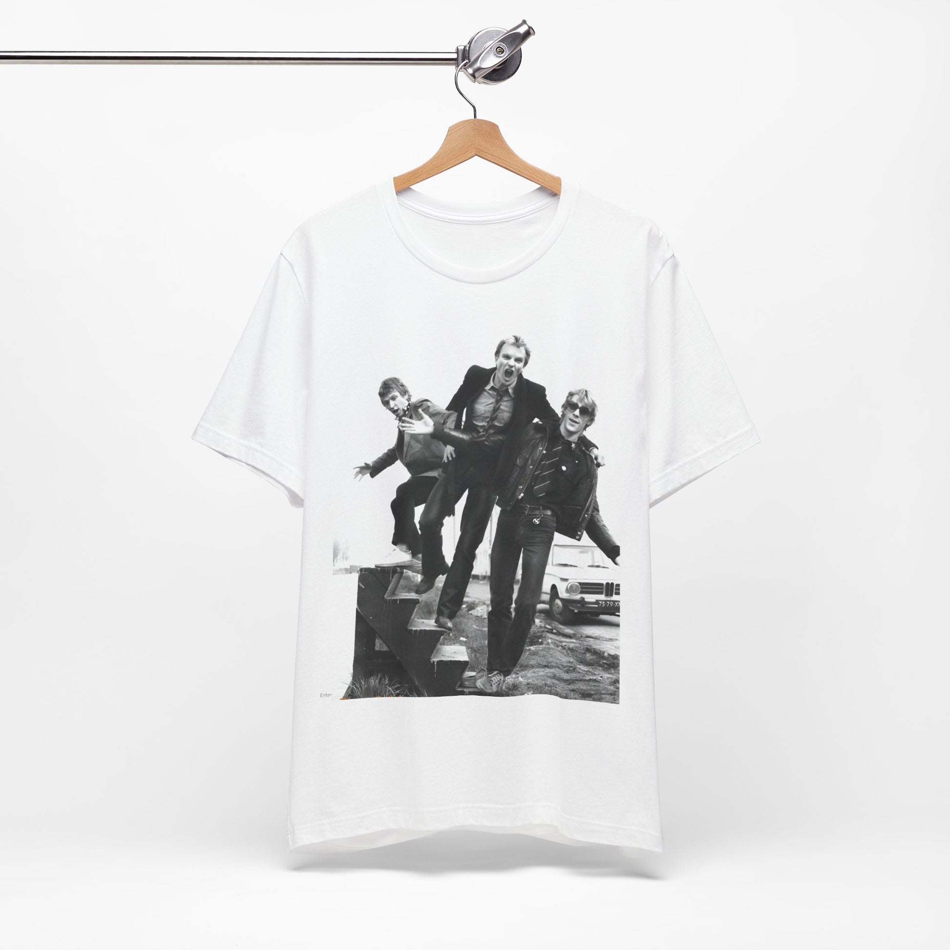 A black graphic t-shirt featuring an early days reggae rock graphic of The Police.