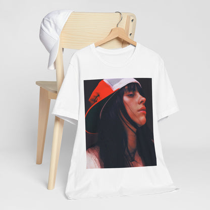 A graphic t-shirt featuring the name 'Billie Eilish' in a raw, urban street-style font.