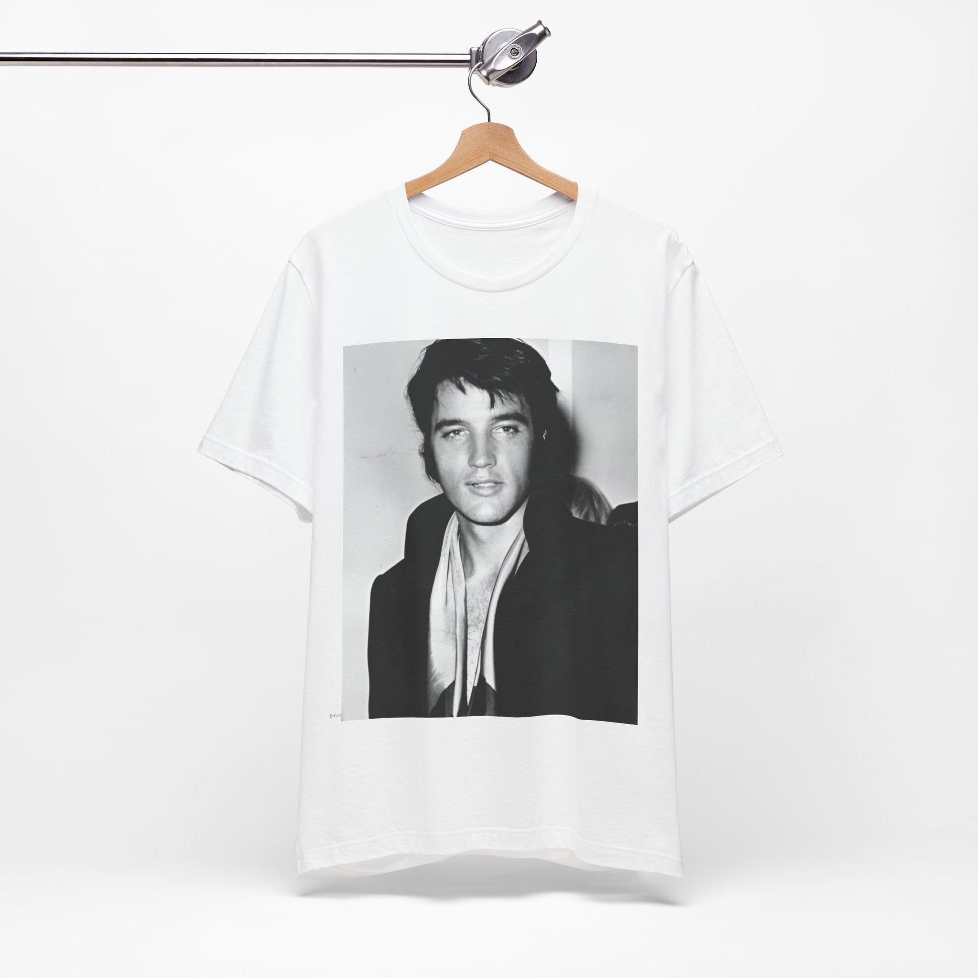 A black graphic t-shirt featuring a black and white rock and roll portrait photo of Elvis Presley.