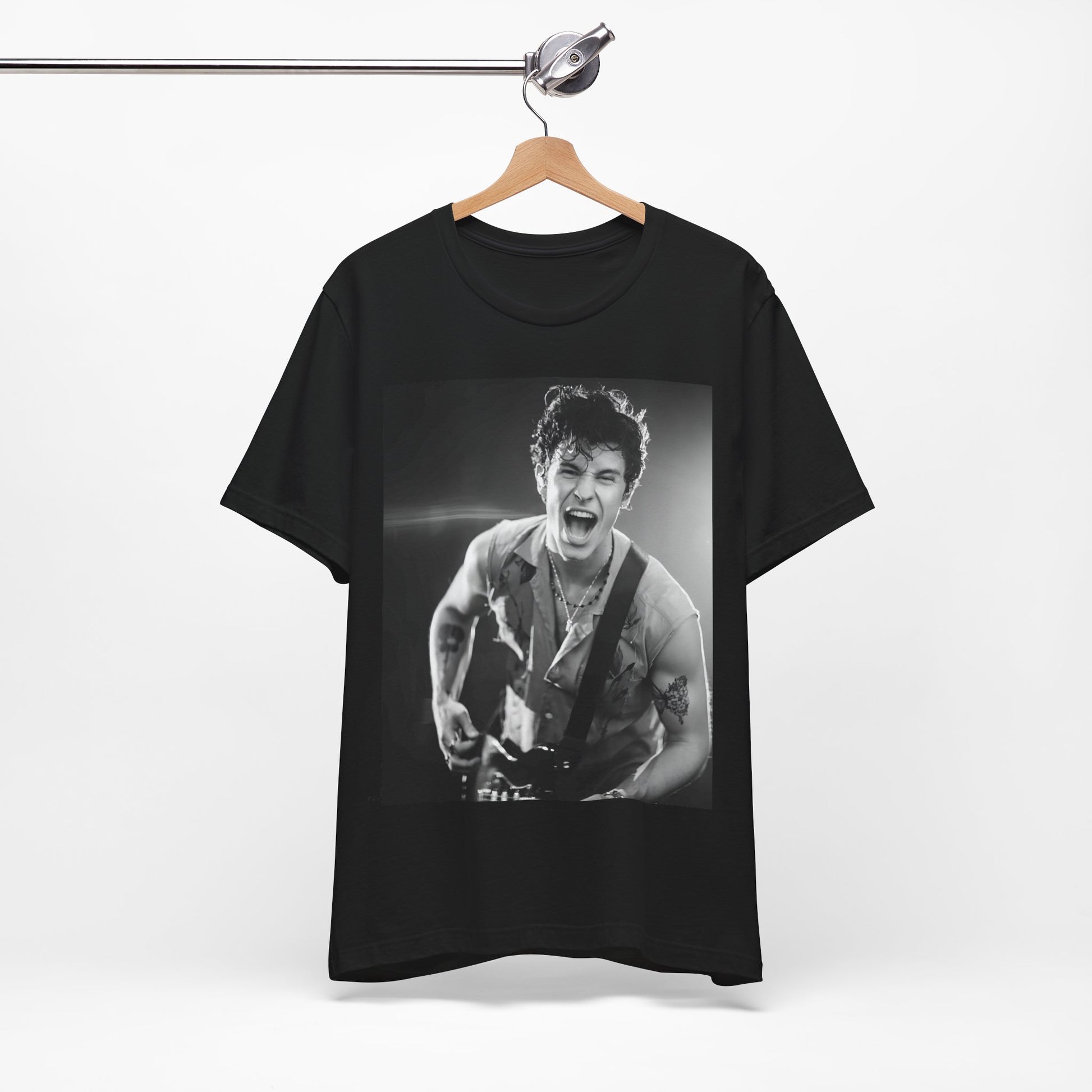 A black graphic t-shirt featuring a black and white photo of Shawn Mendes, emphasizing his charm.