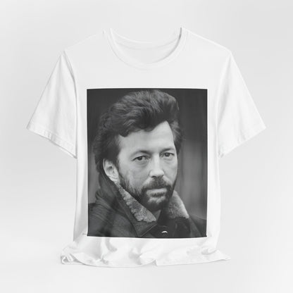 A black graphic t-shirt featuring a 70s rock aesthetic graphic of Eric Clapton.