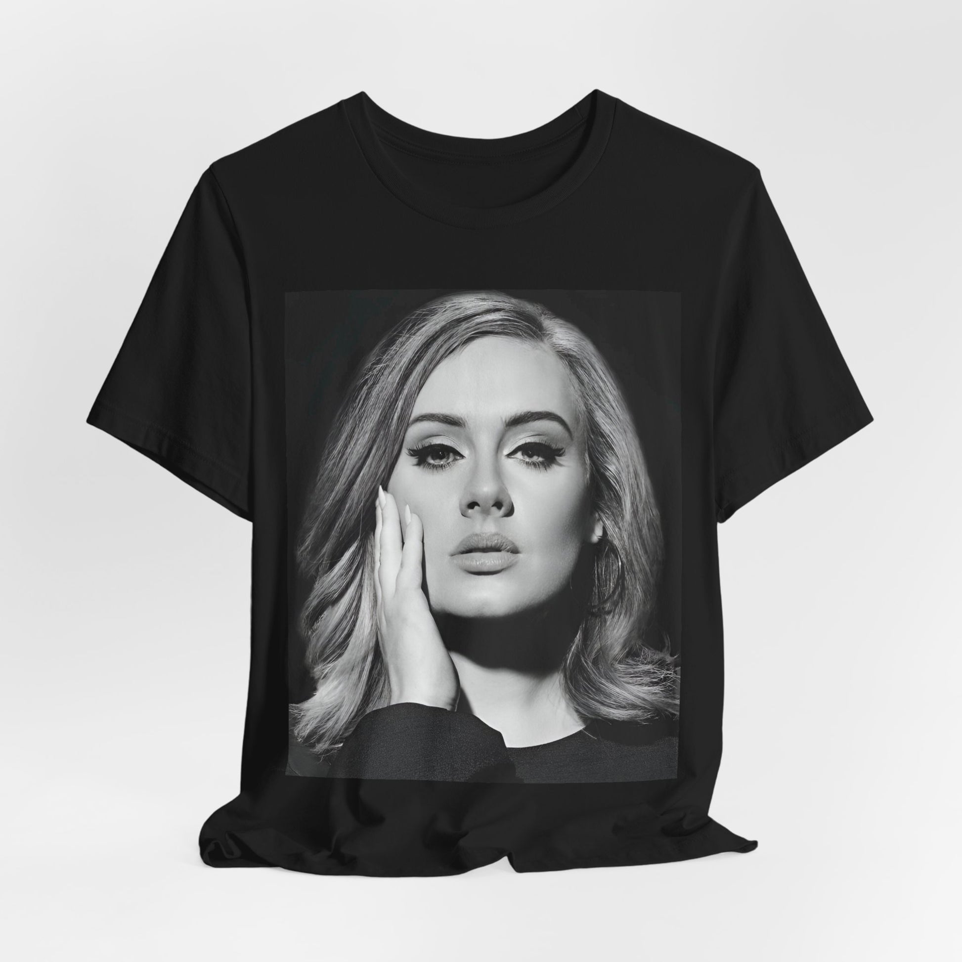 A black graphic t-shirt featuring a studio portrait of Adele from her '25' album era, showing a poised and thoughtful expression with her hair styled elegantly.