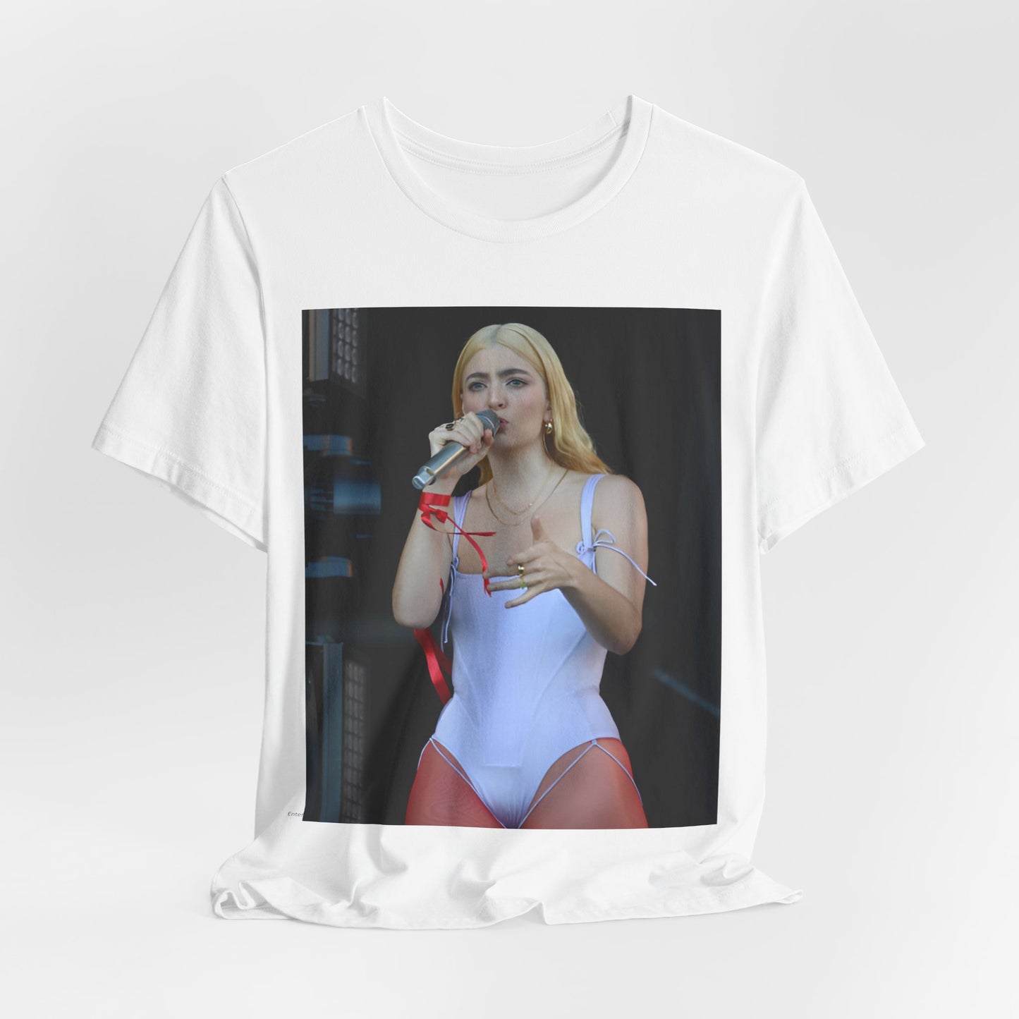 A black graphic t-shirt featuring a graphic or photo of Lorde performing on stage in a cool alternative music style.
